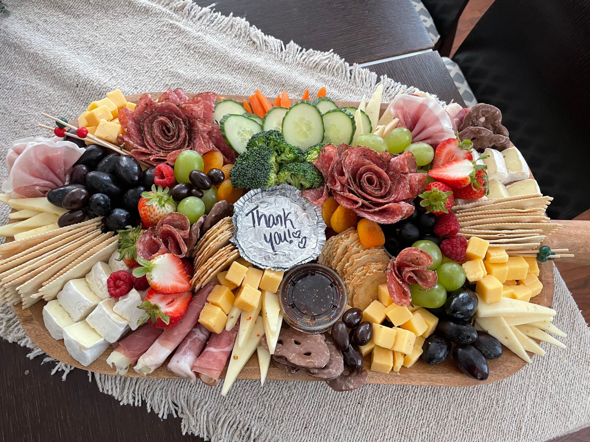 Hand-arranged charcuterie board with meats, cheeses and fresh fruit